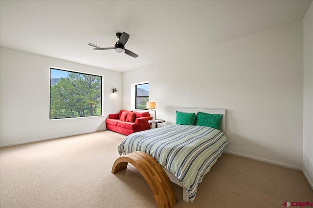 bedroom with ceiling fan and carpet flooring