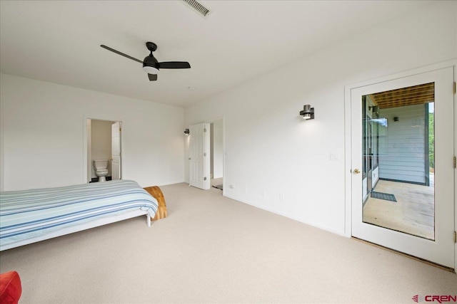 carpeted bedroom with connected bathroom and ceiling fan