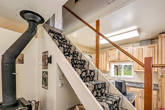 stairway with a wood stove