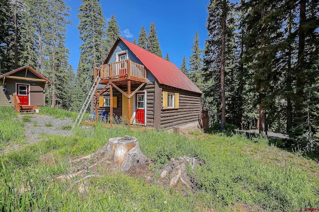 view of log cabin