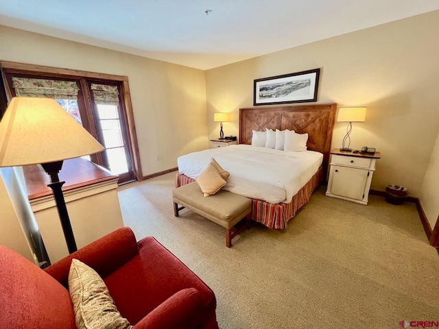 bedroom with light colored carpet