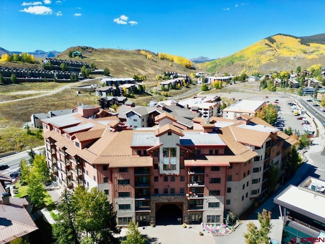 drone / aerial view featuring a mountain view