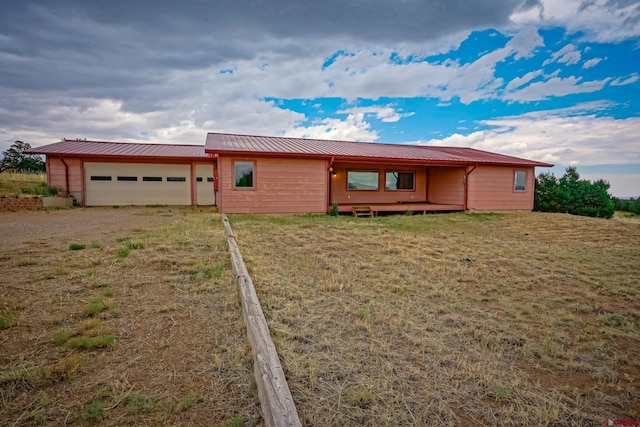 ranch-style home featuring a garage and a front yard