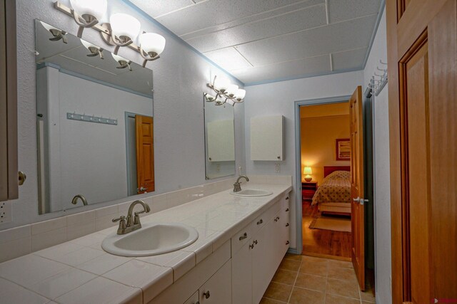 bathroom featuring tile patterned flooring and double sink vanity