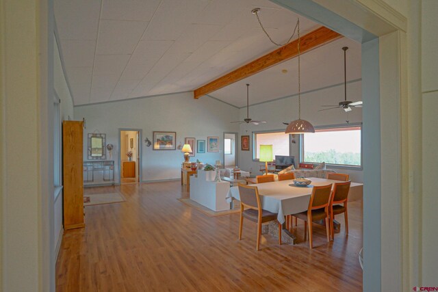 dining area with high vaulted ceiling, beam ceiling, ceiling fan, and hardwood / wood-style floors