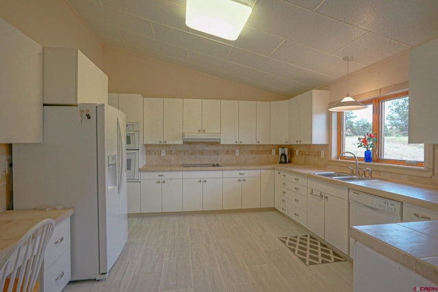 kitchen with decorative light fixtures, decorative backsplash, white cabinets, white appliances, and sink