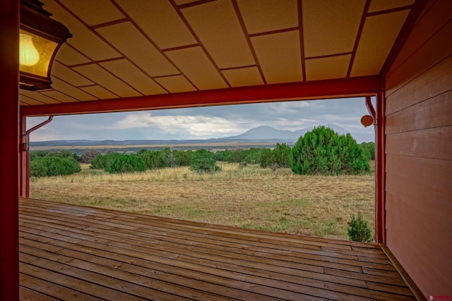 wooden terrace featuring a mountain view