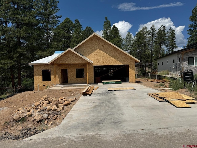 property under construction with an attached garage, crawl space, and concrete driveway