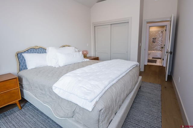 bedroom featuring dark hardwood / wood-style floors and a closet