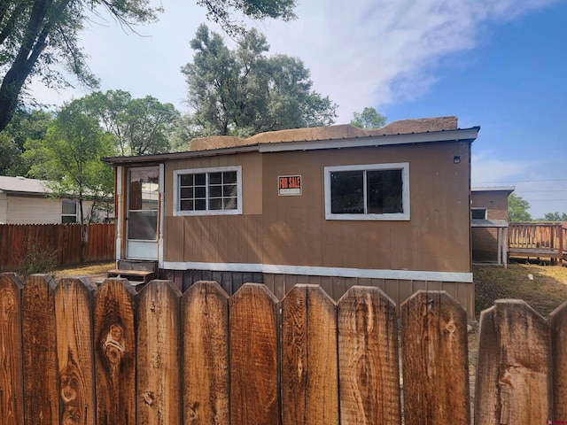 exterior space featuring a wooden deck