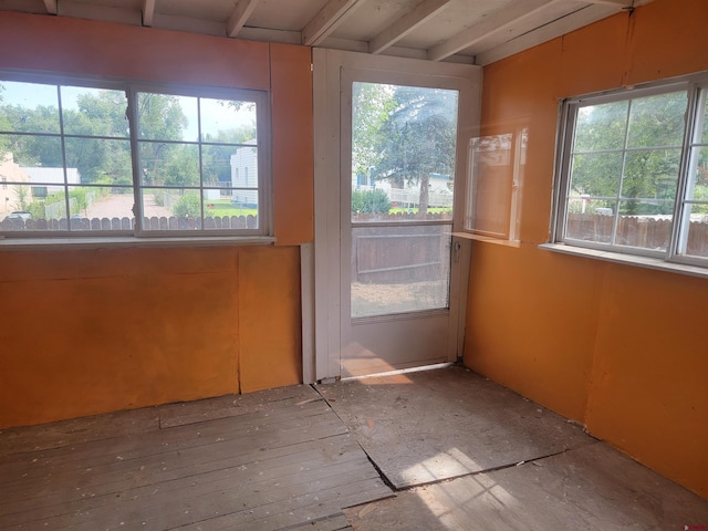 unfurnished sunroom featuring plenty of natural light