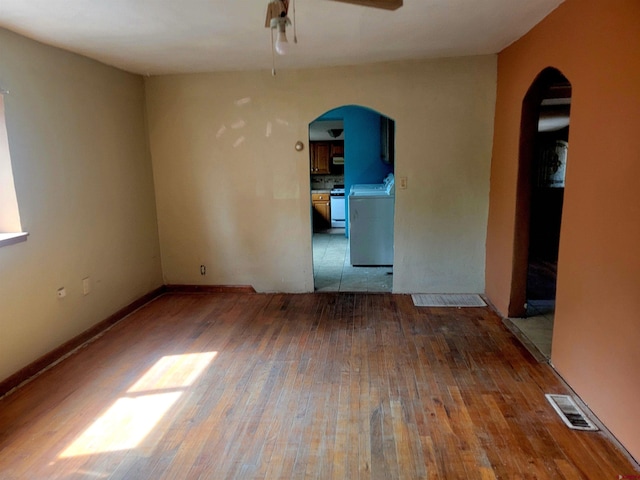 tiled empty room featuring ceiling fan