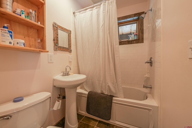 bathroom featuring tile patterned flooring, shower / tub combo, and toilet