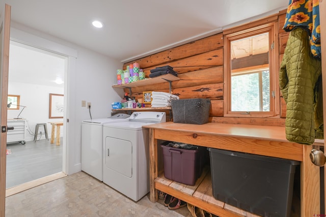 clothes washing area featuring separate washer and dryer