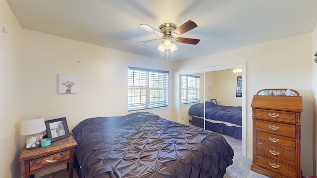 bedroom with a ceiling fan, carpet, and a closet