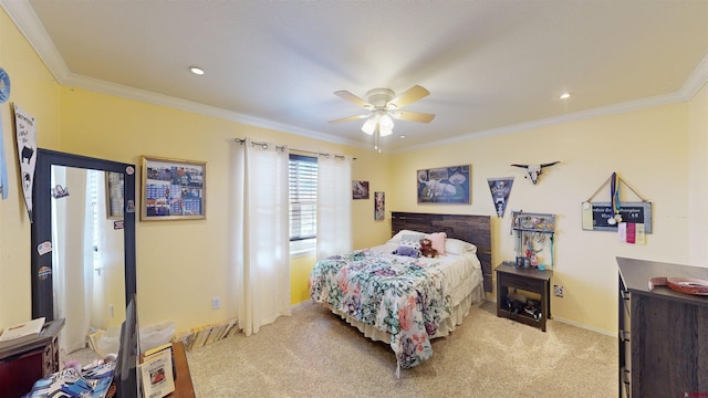 bedroom featuring baseboards, ornamental molding, a ceiling fan, and light colored carpet