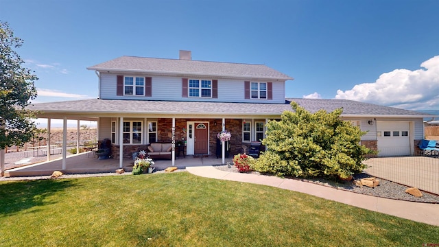 view of front of house with stone siding, an attached garage, a chimney, and a front lawn