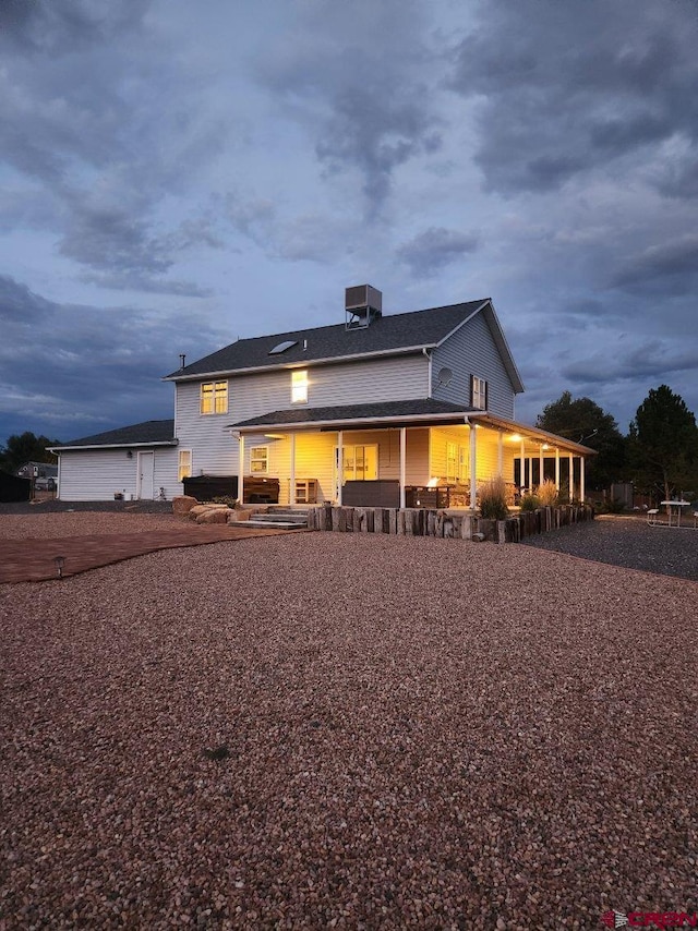 back of property featuring a porch