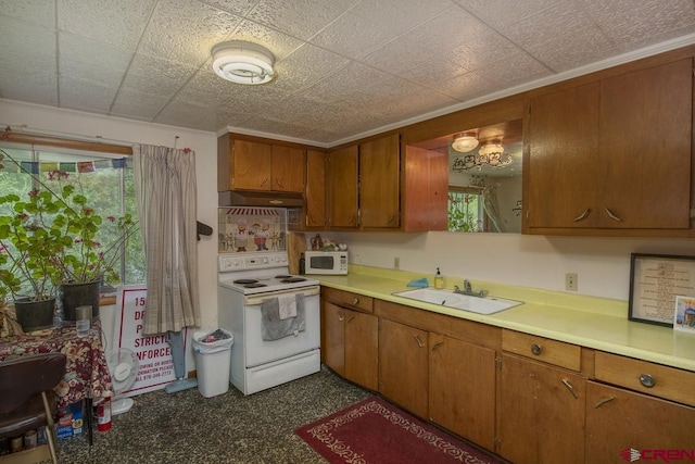 kitchen with sink and white appliances