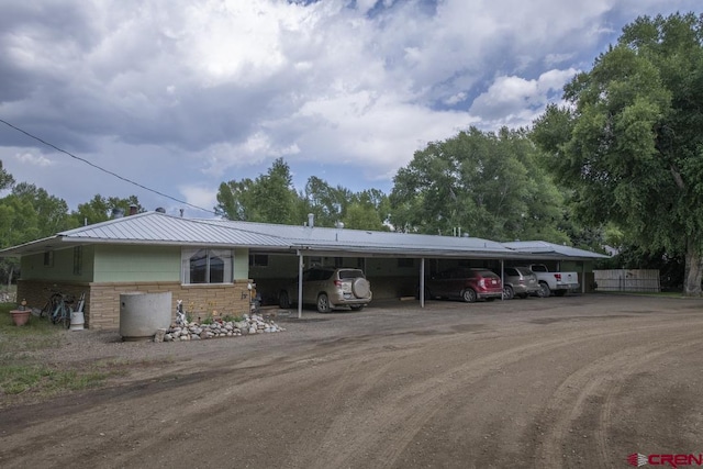 view of front of home featuring a carport