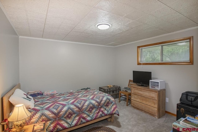 carpeted bedroom featuring ornamental molding