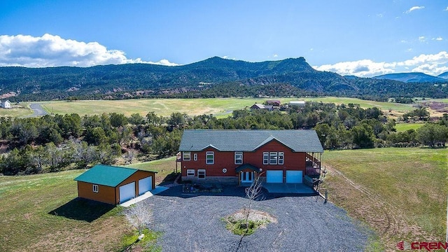 birds eye view of property with a mountain view