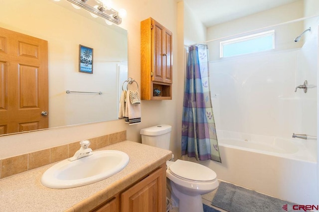 full bathroom with vanity, toilet, and shower / bath combo with shower curtain