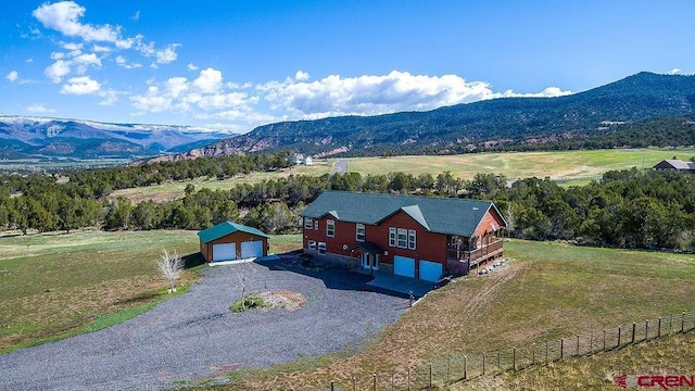 aerial view featuring a rural view and a mountain view