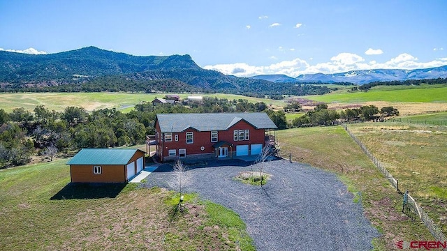 aerial view featuring a mountain view and a rural view