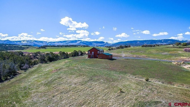 mountain view featuring a rural view