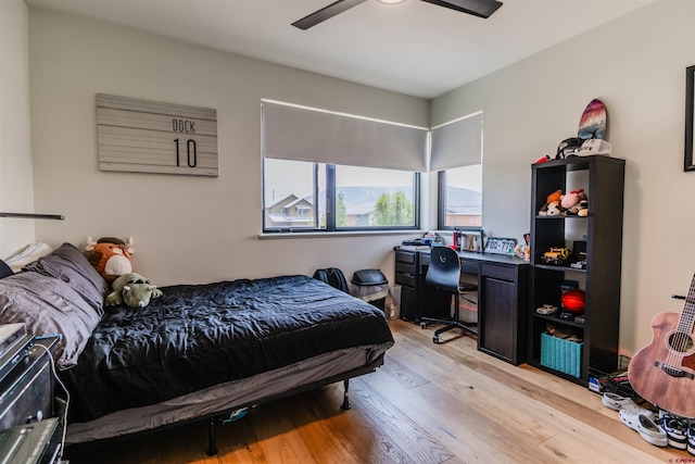 bedroom with ceiling fan and light wood finished floors