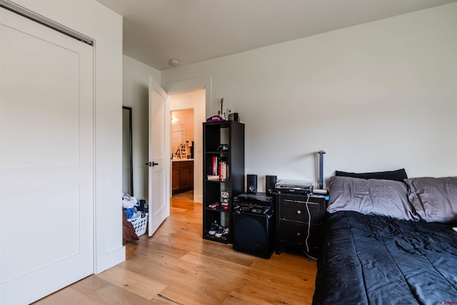 bedroom featuring light wood-style floors