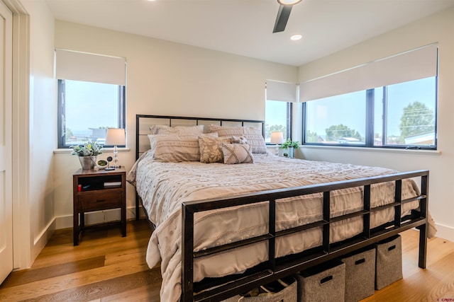 bedroom featuring baseboards, ceiling fan, recessed lighting, and light wood-style floors