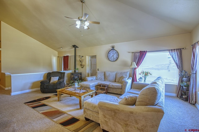 carpeted living room featuring ceiling fan, lofted ceiling, and a wood stove