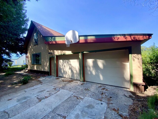 view of property exterior with a garage