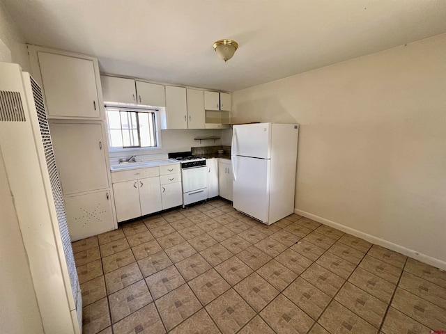 kitchen featuring white cabinetry, sink, and white appliances