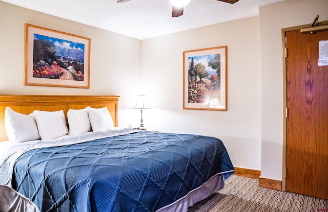 bedroom featuring a textured ceiling and ceiling fan