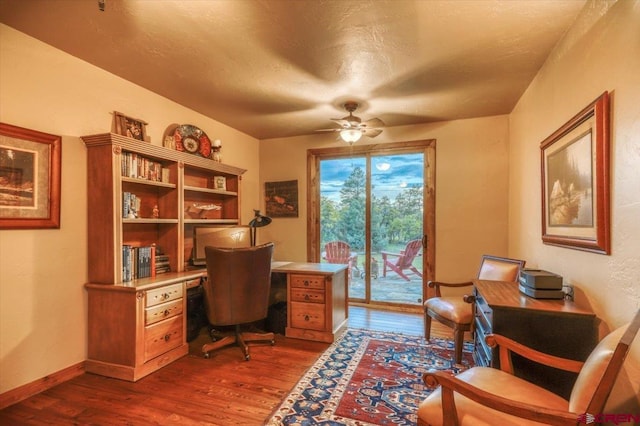387 Bristlecone Dr, Pagosa Springs, CO 81147 - office area featuring baseboards, ceiling fan, and dark wood-type flooring