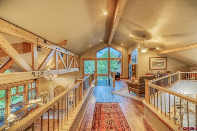 387 Bristlecone Dr, Pagosa Springs, CO 81147 - corridor featuring an upstairs landing, a notable chandelier, vaulted ceiling with beams, and hardwood / wood-style flooring