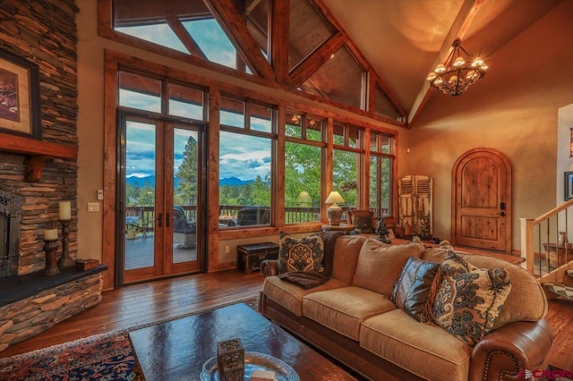 387 Bristlecone Dr, Pagosa Springs, CO 81147 - living room with a wealth of natural light, french doors, hardwood / wood-style floors, and high vaulted ceiling