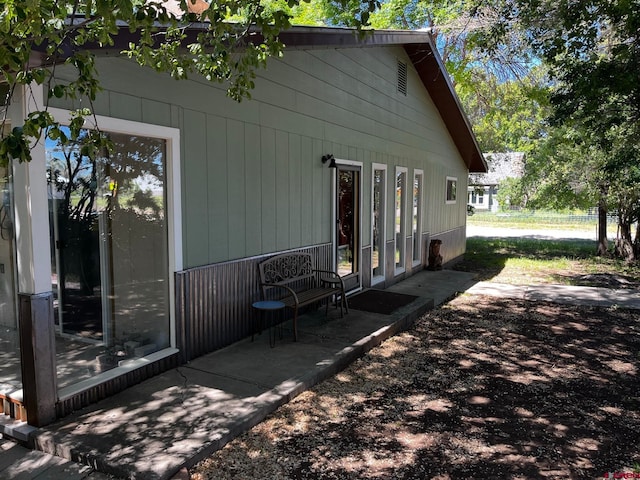 view of side of home featuring french doors