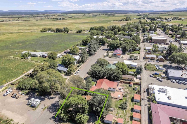 birds eye view of property with a rural view