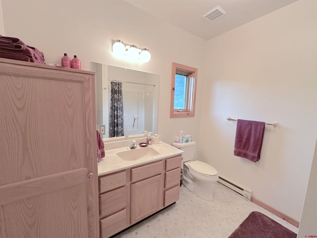 bathroom featuring tile patterned flooring, baseboard heating, toilet, and vanity