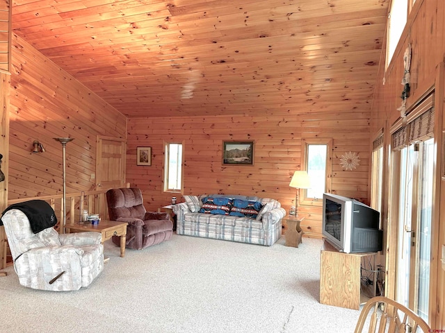 carpeted living room featuring wood ceiling, high vaulted ceiling, and wooden walls