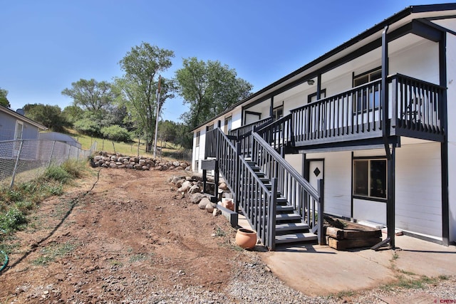 view of yard featuring stairs and fence