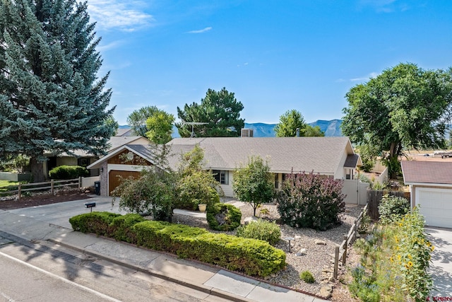 view of front of house with a mountain view and a garage