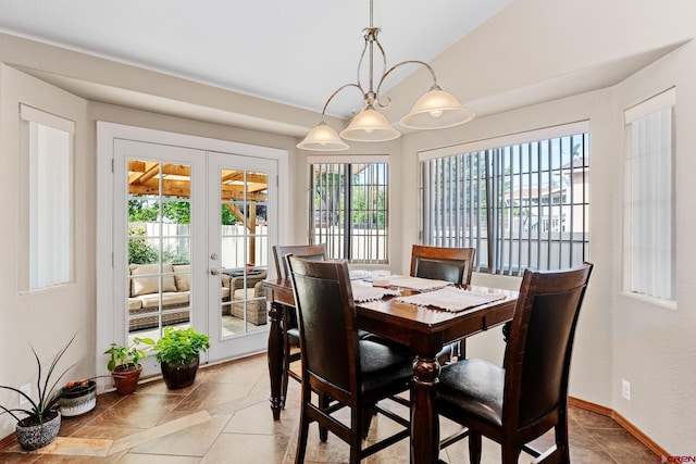 dining space featuring vaulted ceiling, french doors, and baseboards