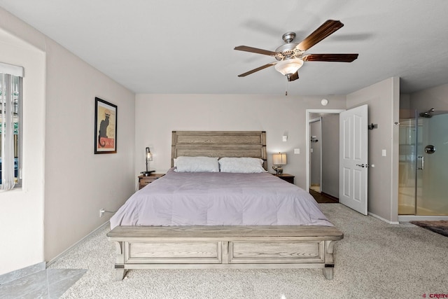 bedroom with carpet floors, ensuite bath, baseboards, and ceiling fan