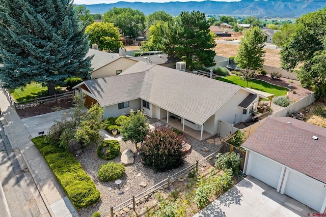 birds eye view of property with a mountain view