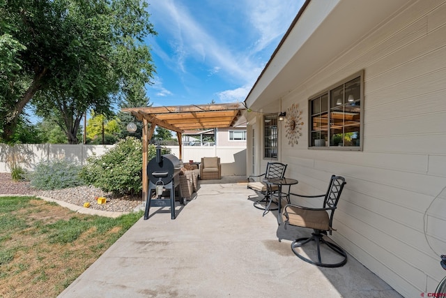 view of patio / terrace with fence, a pergola, and area for grilling